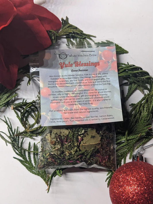 Yule Blessings loose incense by White Witches Brew with evergreens and a red ornament