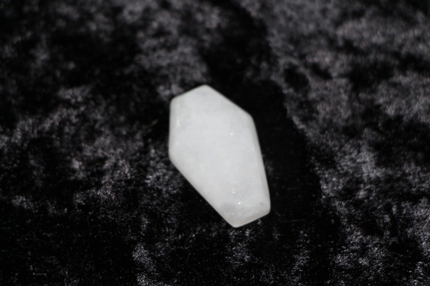 Clear quartz crystal on black velvet, modern witch ritual tool, Witches' Brew