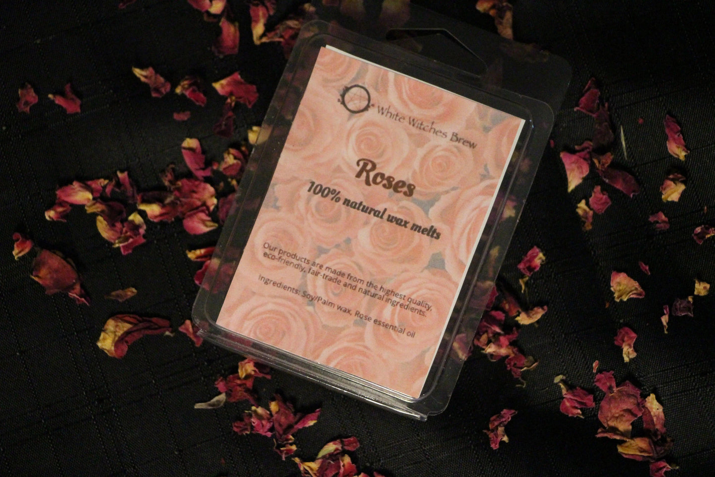 Roses natural wax melts by Witches' Brew on black cloth with rose petals, eco-friendly product