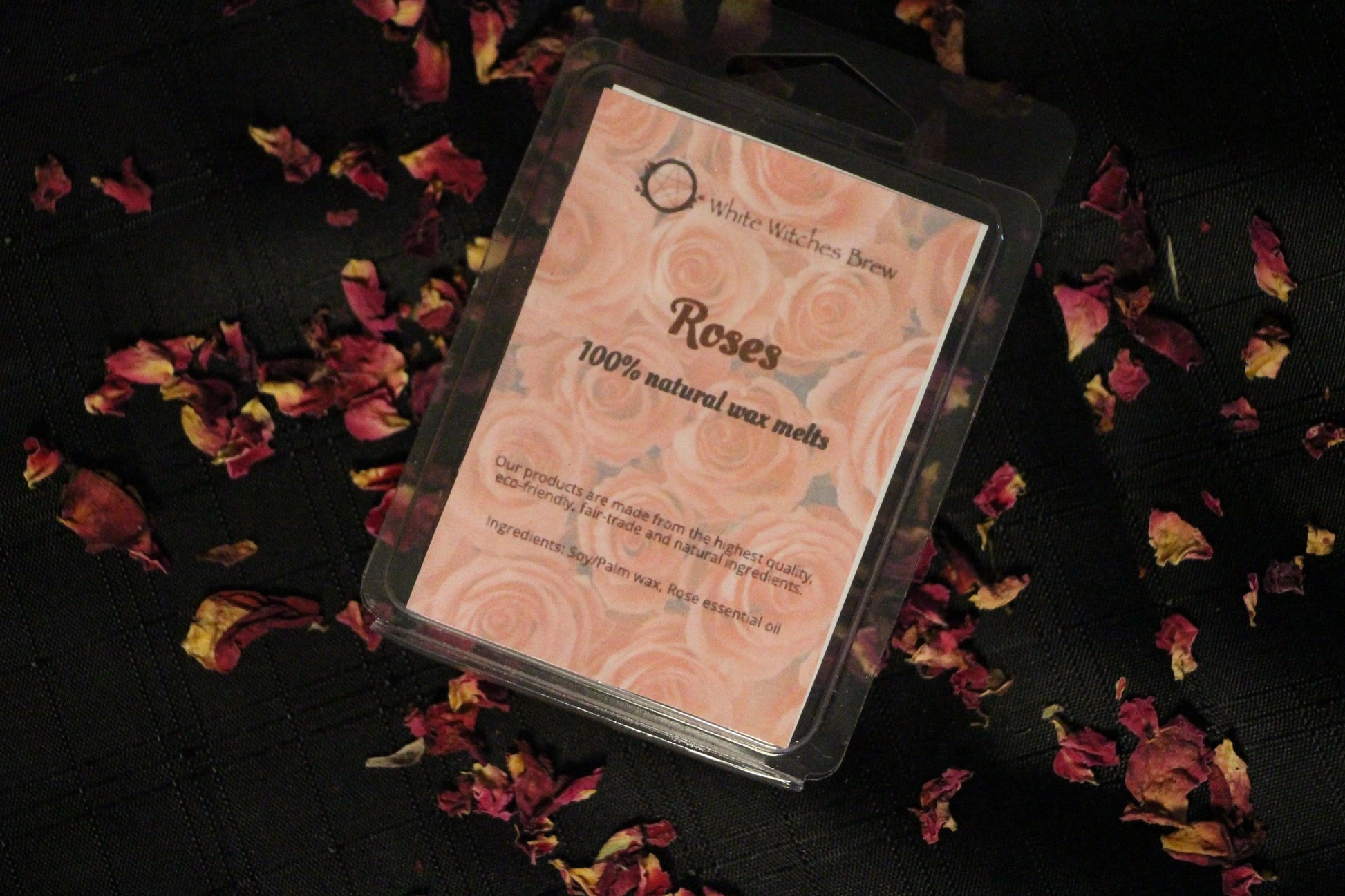 Roses natural wax melts by Witches' Brew on black cloth with rose petals, eco-friendly product