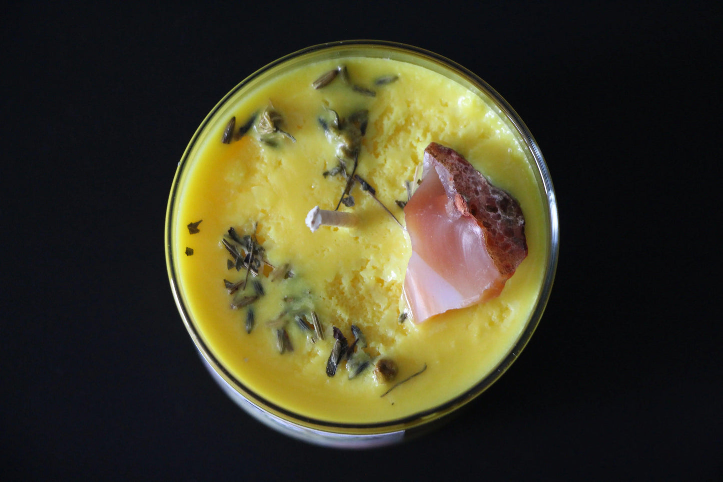 Yellow crystal candle with herbs and gemstone, hand-crafted witch ritual tool