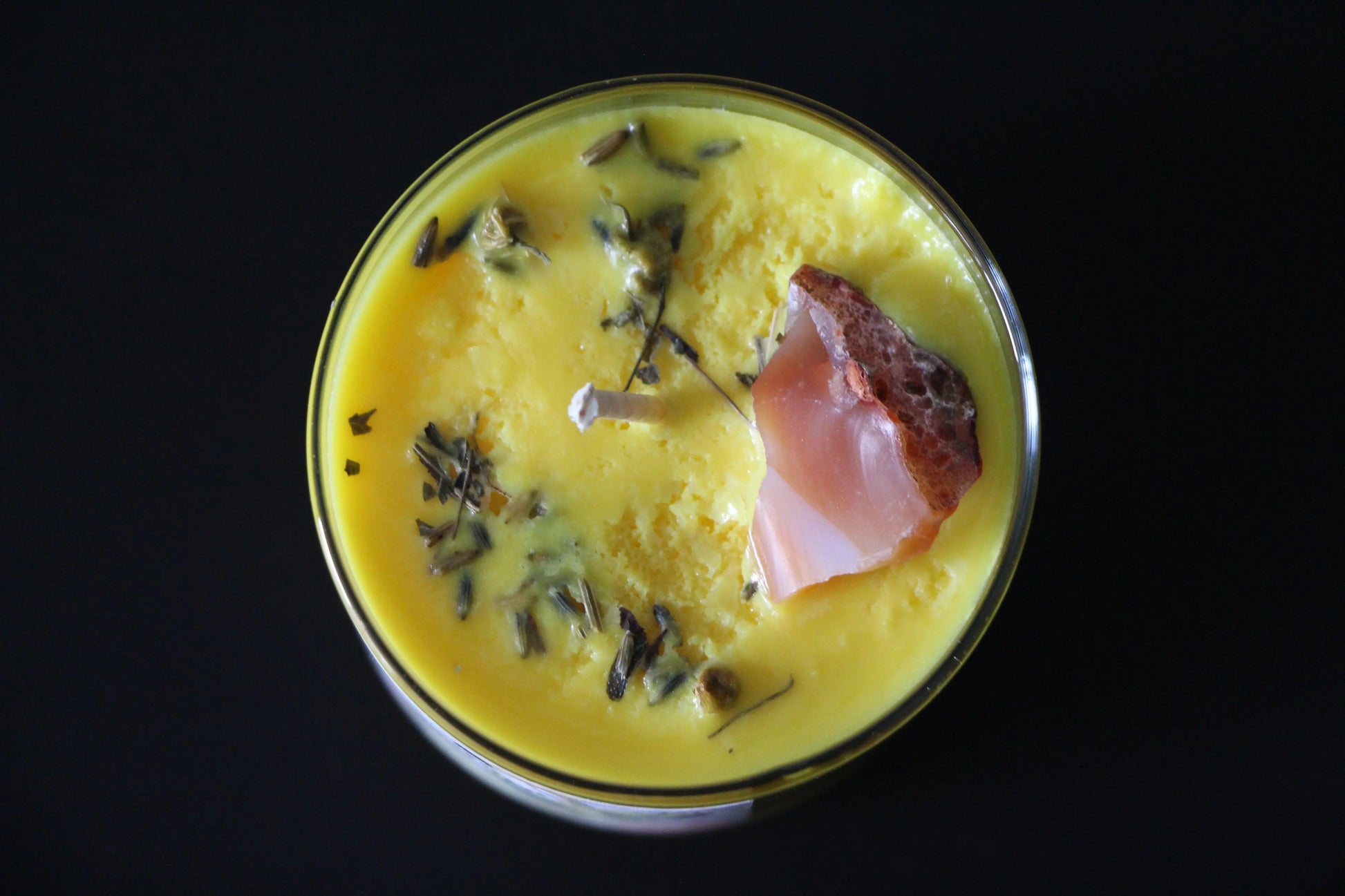 Yellow crystal candle with herbs and gemstone, hand-crafted witch ritual tool