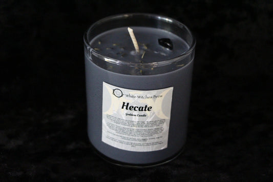 Hecate Goddess candle by White Witches Brew in a dark gray glass jar with white wick